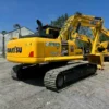 Side profile of the PC240, a high-quality used komatsu excavator for sale.