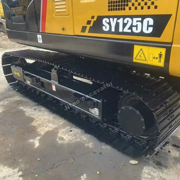 Close-up of the durable crawler tracks on this used excavator model.