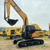 Efficient Digging Power Sany SY215 crawler with its boom raised, showing the strength of the used excavator buckets.