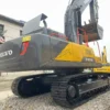 Angled track and cabin view. Low-hour used volvo excavators for sale.