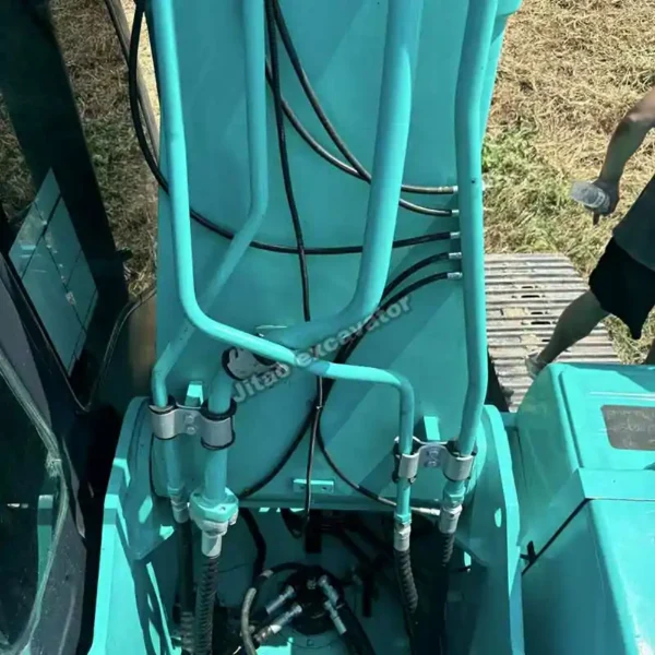 Original Mechanical Parts Detailed view of hydraulics in a Kobelco SK260LC used excavator for sale.