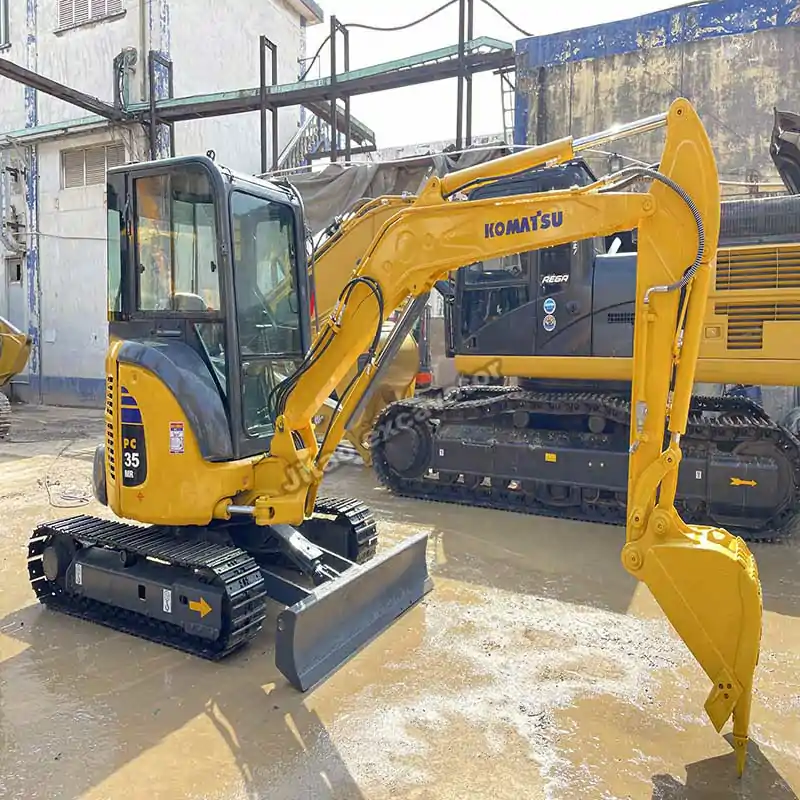Rear view showing zero tail swing of a mini excavator used for sale.