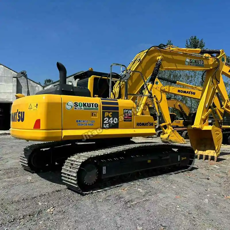 Full side view of Komatsu PC240 crawler, part of our used komatsu excavator for sale.