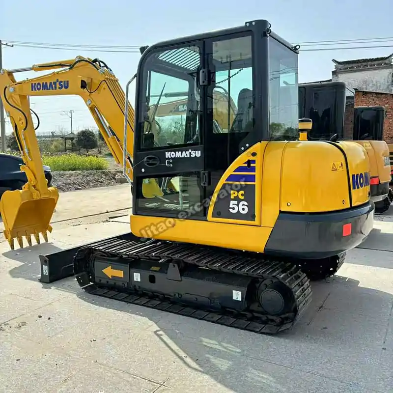Frontal view of the Komatsu PC56 cabin for buyers of used mini excavators near me.