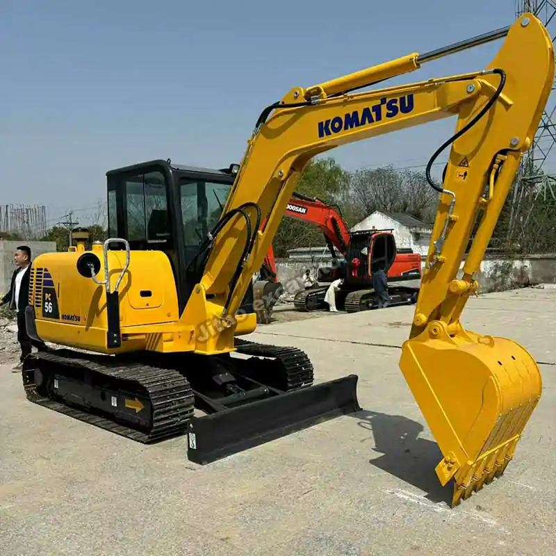 Profile view of a certified PC56, the best choice for used mini excavators near me.