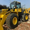 Full side view of a Komatsu WA380 used mini bulldozer for sale.