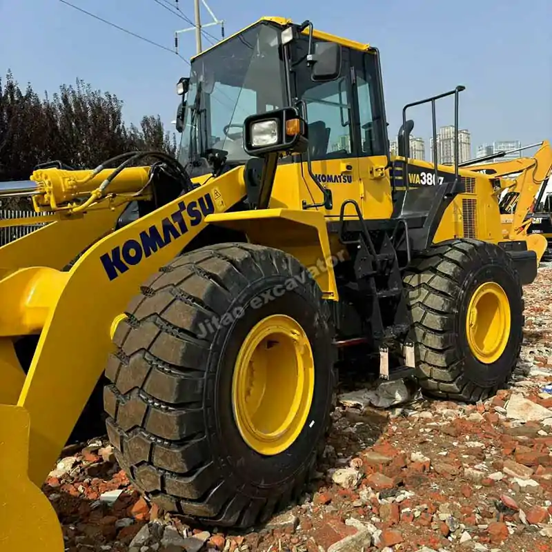 Full side view of a Komatsu WA380 used mini bulldozer for sale.
