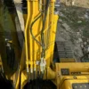 Close-up of Komatsu PC120 hydraulic lines, ready as used mini excavators for sale near me.