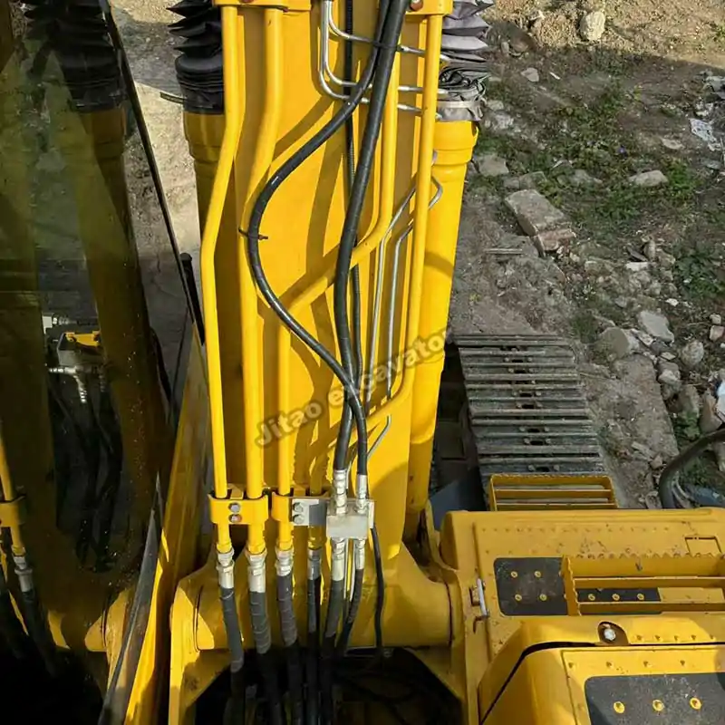 Close-up of Komatsu PC120 hydraulic lines, ready as used mini excavators for sale near me.