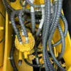 Top view of PC130 hydraulic lines, ready as a used mini excavator for sale near me.