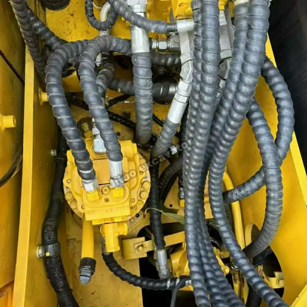 Top view of PC130 hydraulic lines, ready as a used mini excavator for sale near me.