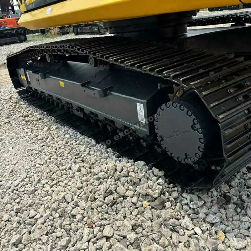 Close-up of the PC240LC long crawler tracks, essential for a used komatsu excavator.