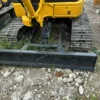 Dozer blade detail of the PC40MR available for mini excavators used for sale.