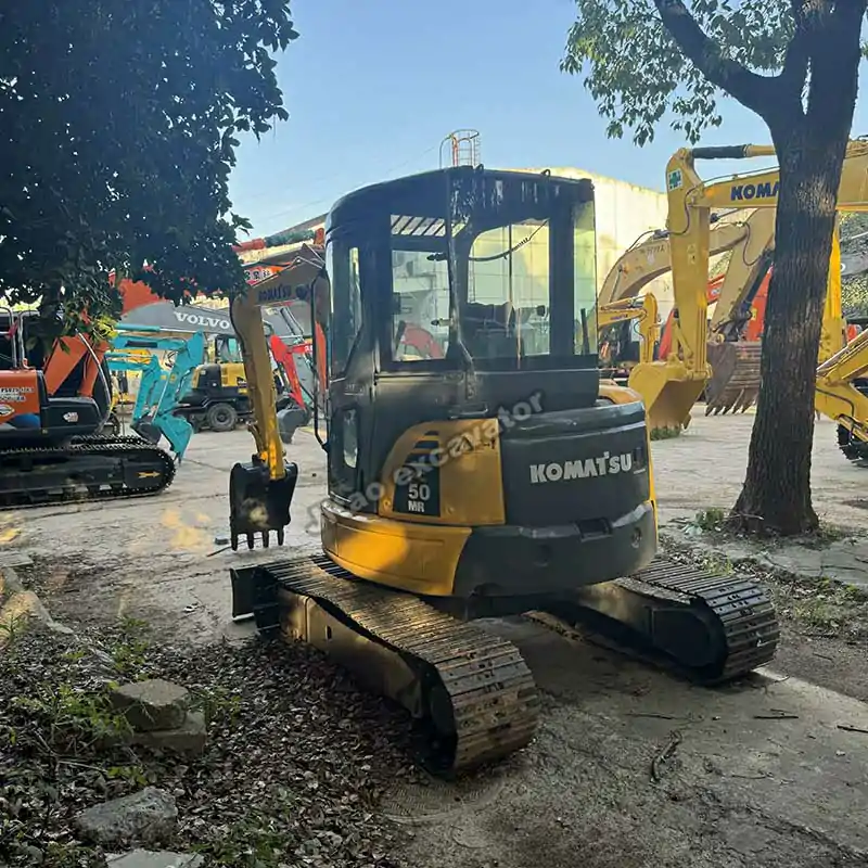 Front view featuring the blade on this mini excavator for sale used.