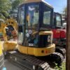 CAT 303C Cabin and Tracks Pre-owned CAT 303C used excavator for sale showing the cabin and tracks.