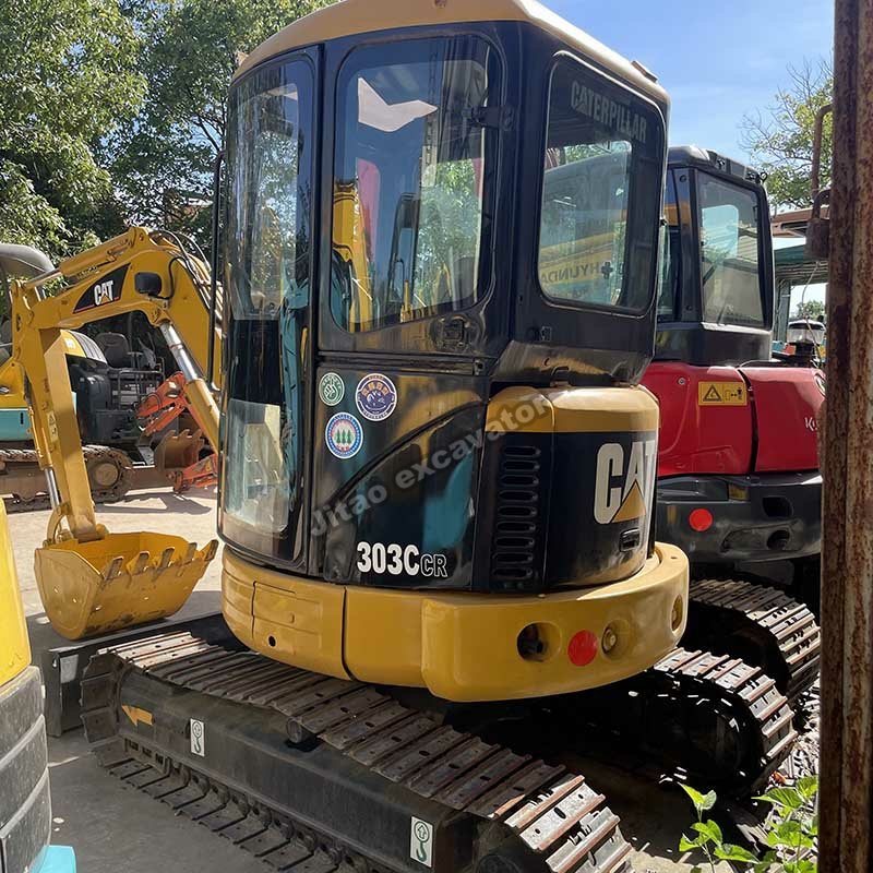 Pre-owned CAT 303C used excavator for sale showing the cabin and tracks.