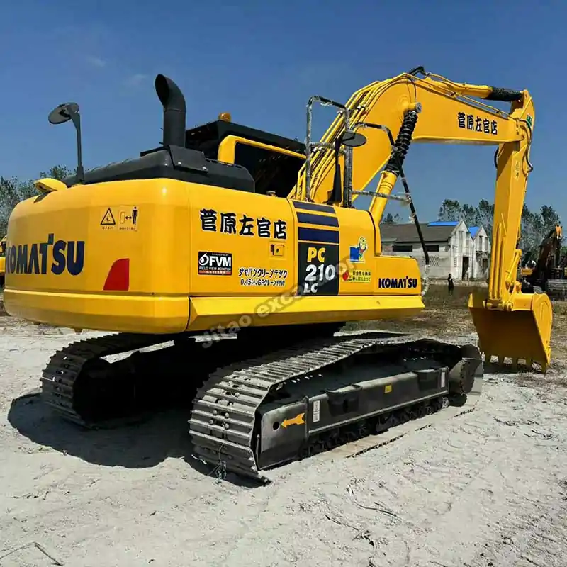 Rear perspective of Komatsu PC210, showing durability for any used small excavator buyer.