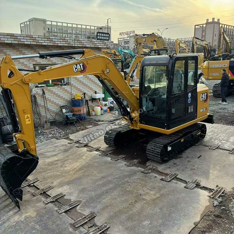 Three-quarter view of a reliable used Caterpillar 305.5E2 compact digger.