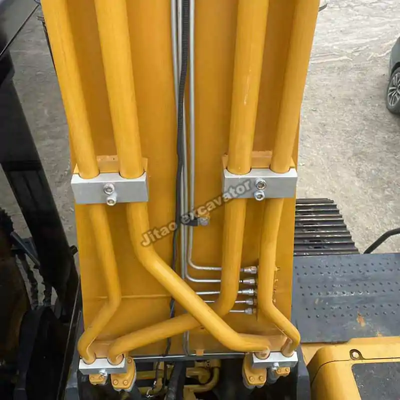 Detail of Sany SY215C hydraulic lines powering our used excavator buckets for sale.
