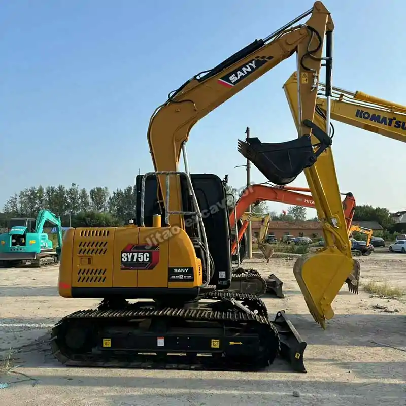 Side view of a Sany SY75, a premium model among our used mini excavators for sale.
