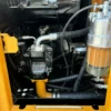 Detailed view of the hydraulic pump on a Sany SY75C mini used excavator.