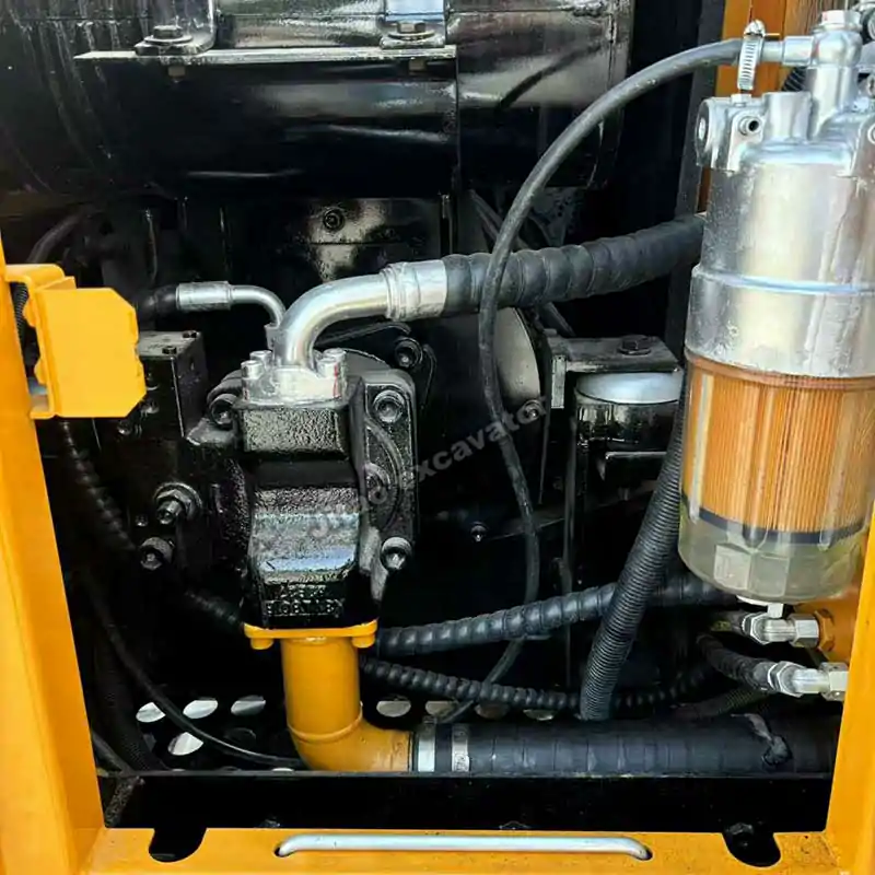 Detailed view of the hydraulic pump on a Sany SY75C mini used excavator.