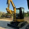 High-quality used CAT 303.5E mini excavator for sale with standard bucket and blade.