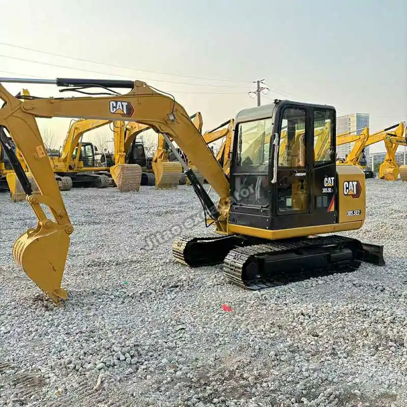 Full side profile of a used Cat 305.5E2 compact excavator for sale.