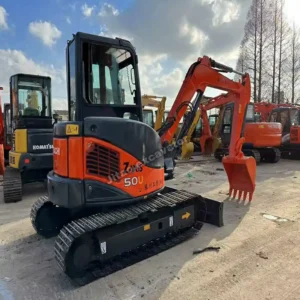 Hitachi 50u Profile Side view of certified used small excavators at Jitao yard.