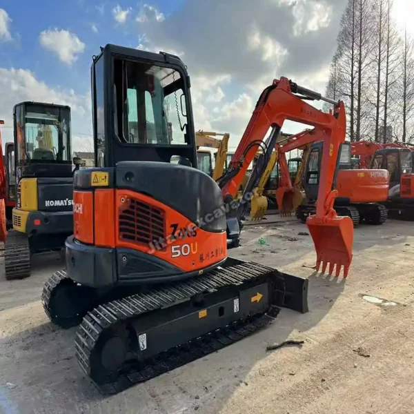 Hitachi 50u Profile Side view of certified used small excavators at Jitao yard.