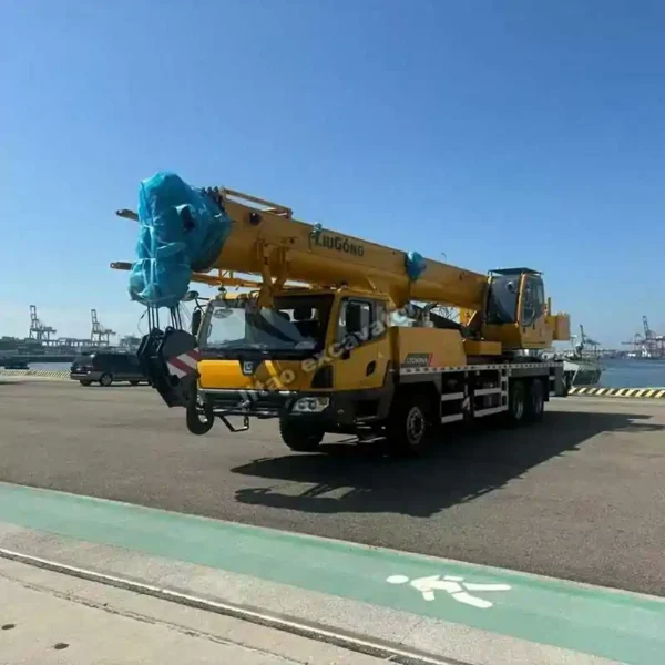 Side view of a verified heavy construction crane ready for export.