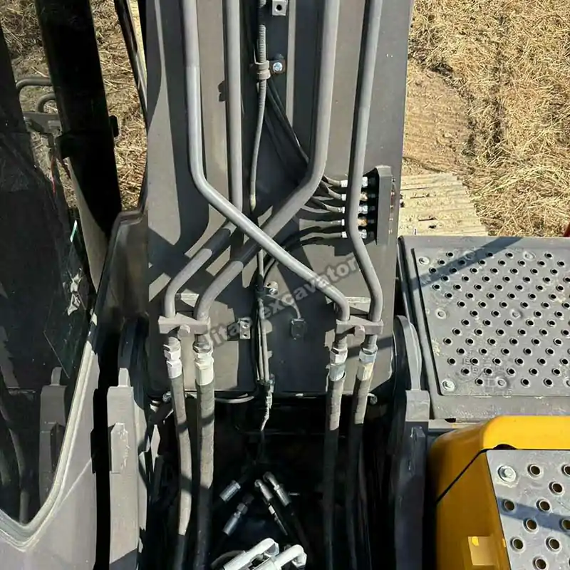Detailed view of the hydraulic lines and major excavator parts used in the Volvo system.